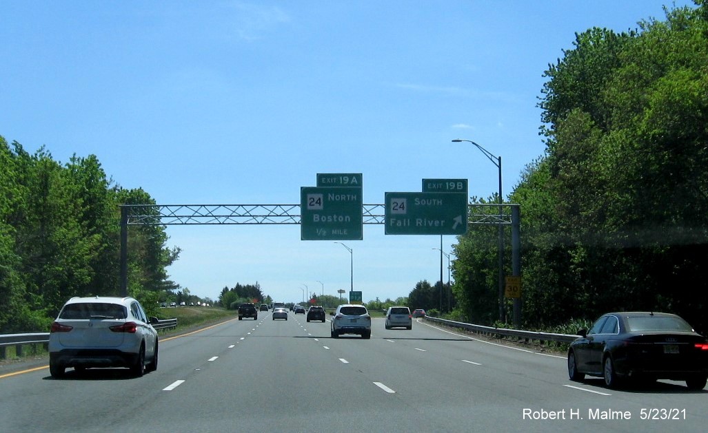 Image of overhead signage at ramp for MA 24 South exit with new milepost based exit numbers on I-495 South in Raynham, May 2021
