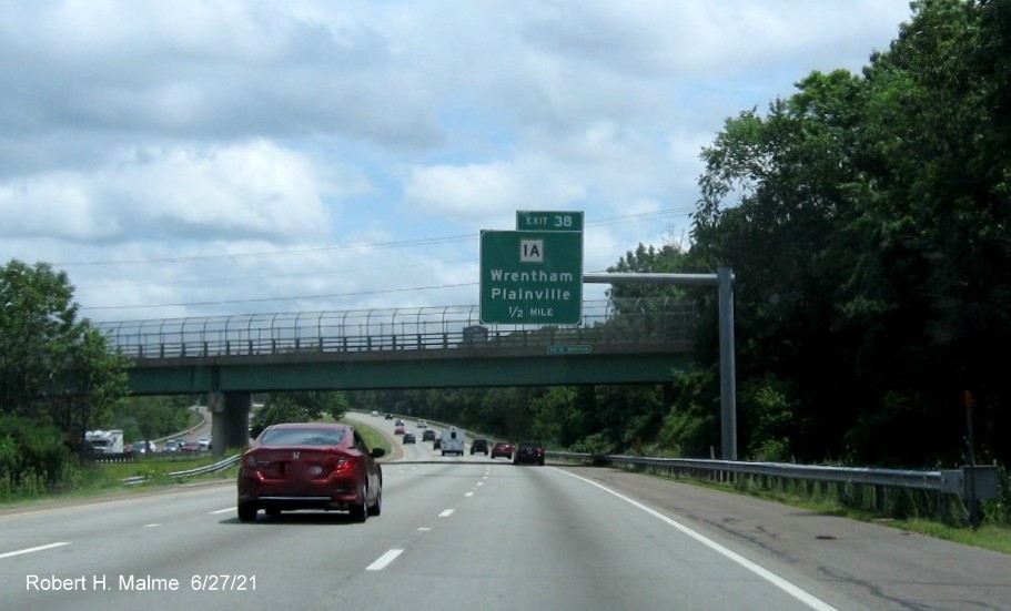 Image of 1/2 mile advance overhead sign for MA 1A exit with new milepost based exit number on I-495 South in Wrentham, June 2021