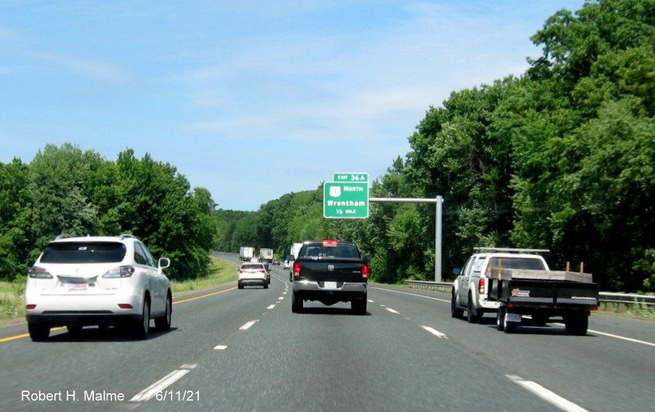 Image of 1/2 Mile advance overhead sign for US 1 North exit with new milepost based exit number on I-495 North in Wrentham, June 2021