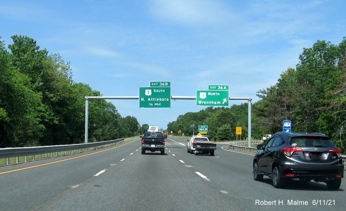 Image of overhead signs at ramp for US 1 North exit with new milepost based exit numbers on I-495 North in Wrentham, June 2021