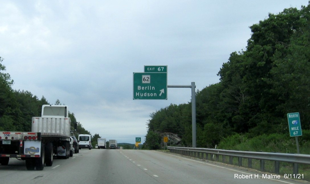 Image of overhead ramp sign for MA 62 exit with new milepost based exit number on I-495 North in Hudson, June 2021