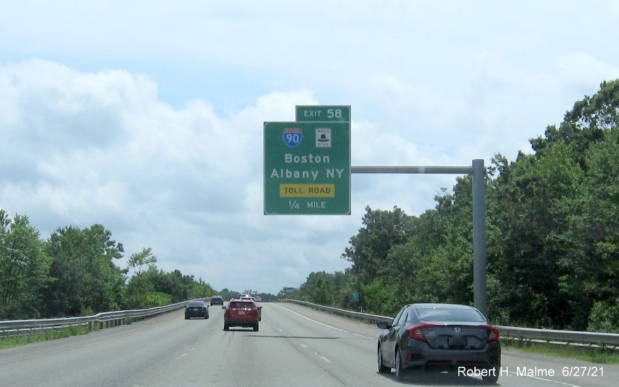 Image of 1/4 mile advance overhead sign for I-90/Mass Pike exit with new milepost based exit number on I-495 South in Hopkinton, June 2021