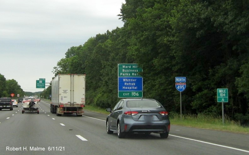 Image of combination green and blue auxiliary sign for  exit with new milepost based exit number on I-495 North in Lawrence, June 2021