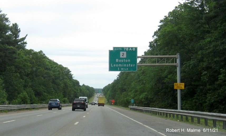 Image of 1 mile advance overhead sign for MA 2 exits with new milepost based exit numbers and yellow Old Exits 29 A-B advisory sign on support on I-495 North in Littleton, June 2021