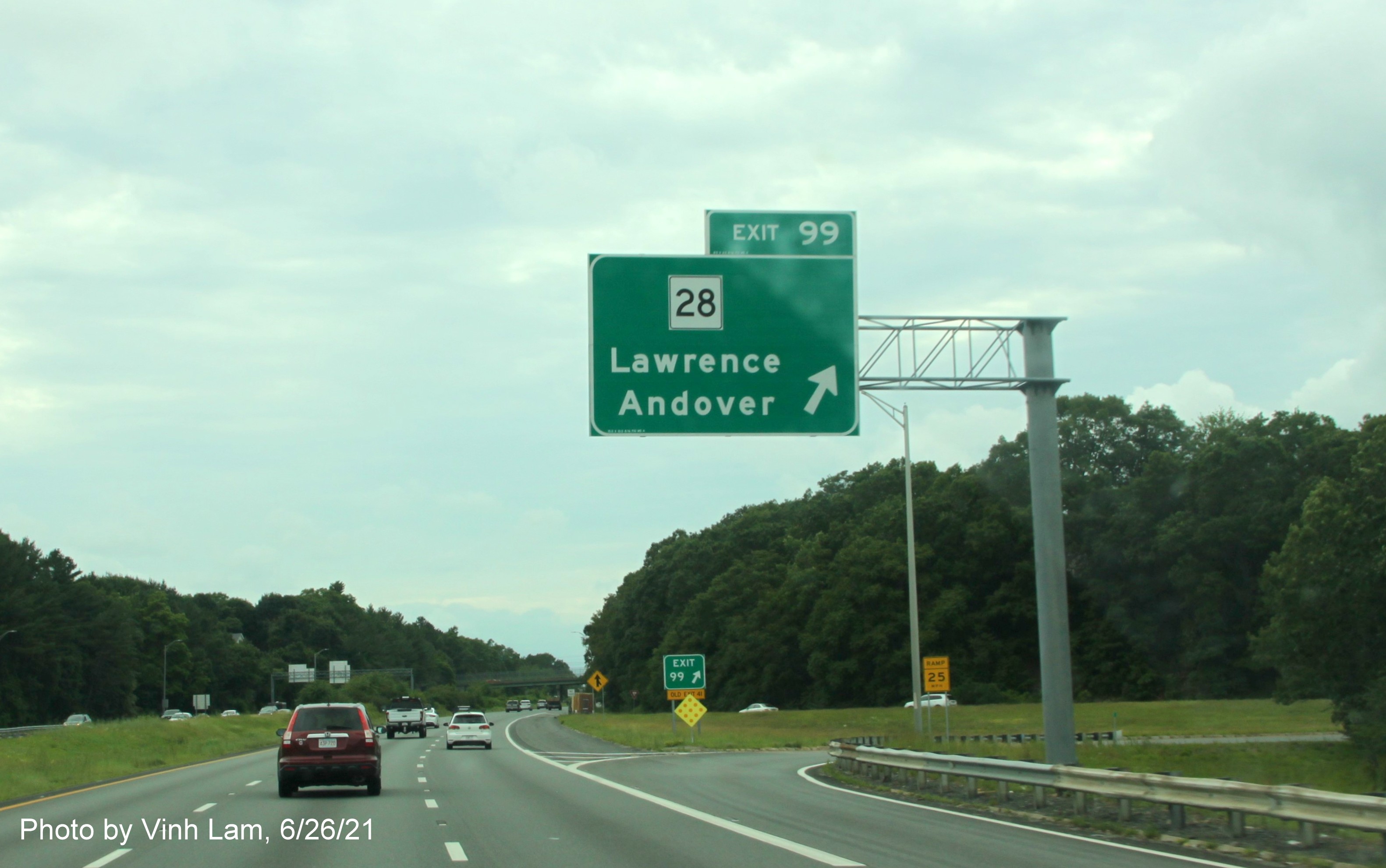 Image of overhead ramp sign for MA 28 exit with new milepost based exit number on I-495 South in Andover, by Vinh Lam, June 2021