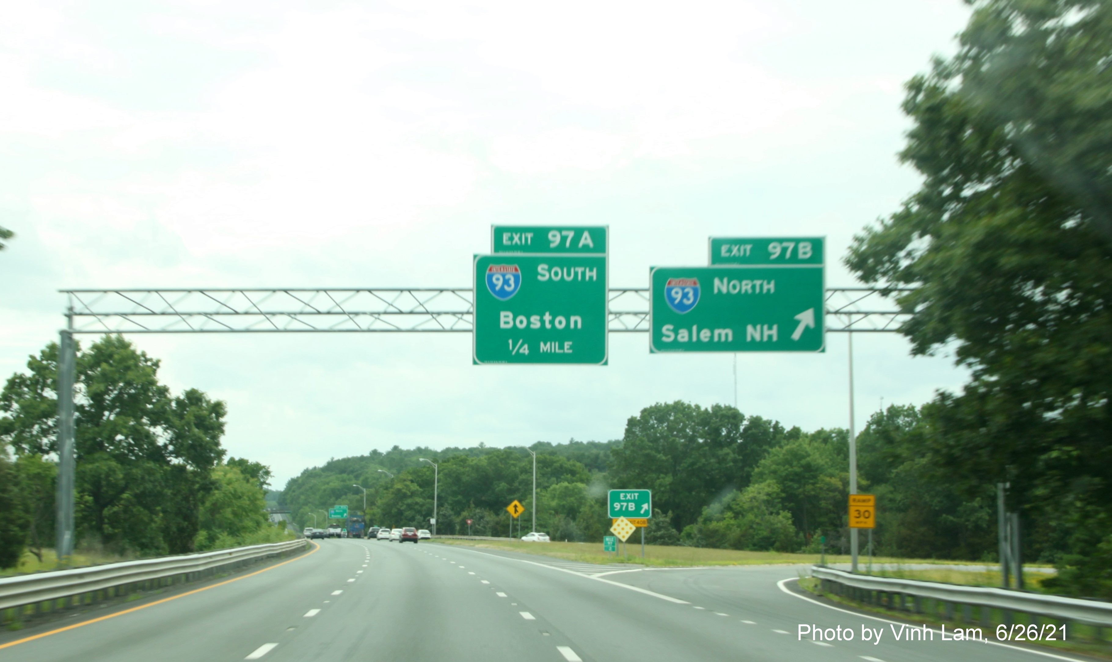 Image of overhead signage at ramp for I-93 North exit with new milepost based exit numbers on I-495 South in Andover, by Vinh Lam, June 2021