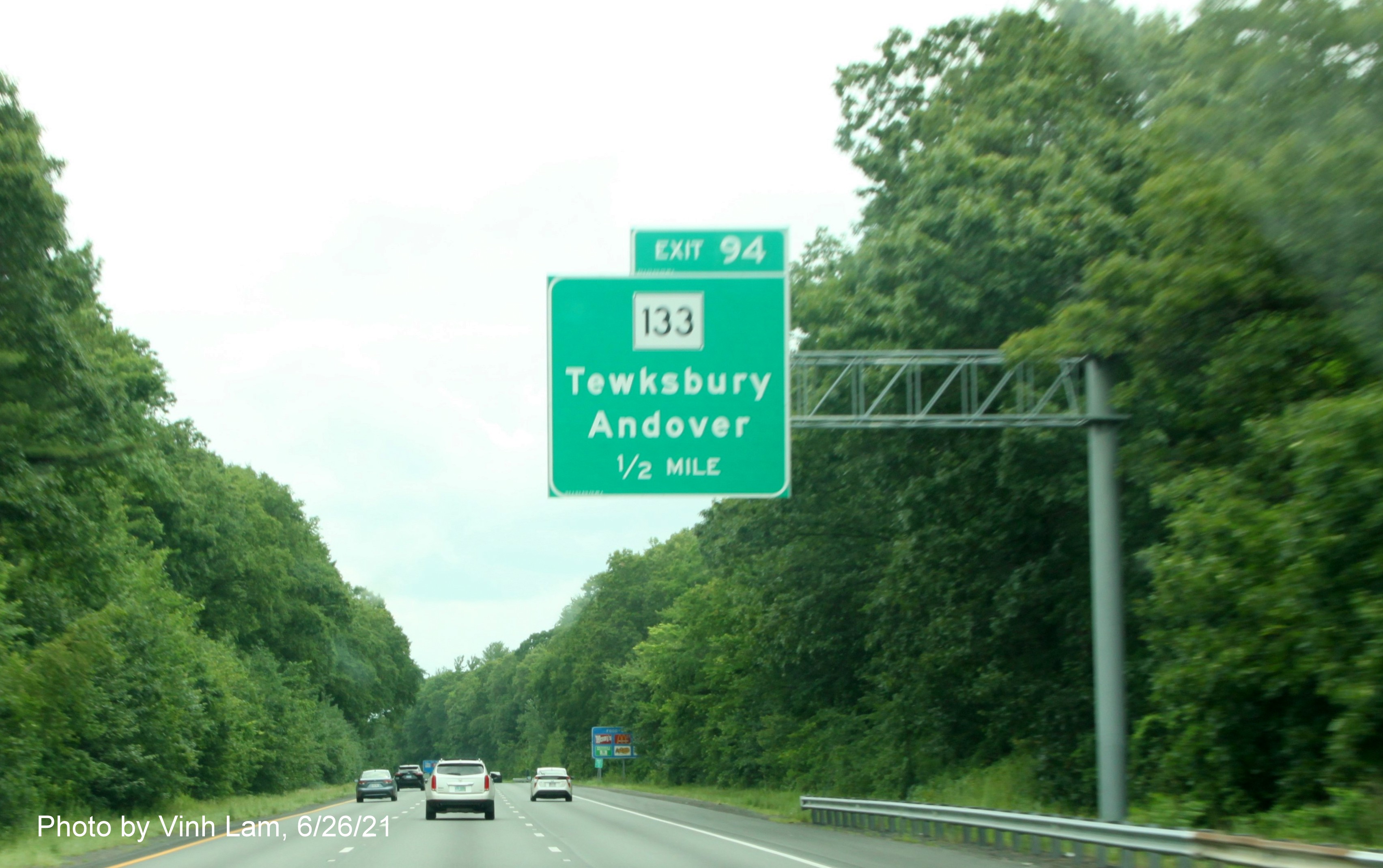 Image of 1/2 mile advance overhead sign for MA 133 exit with new milepost based exit number on I-495 South in Andover, by Vinh Lam, June 2021