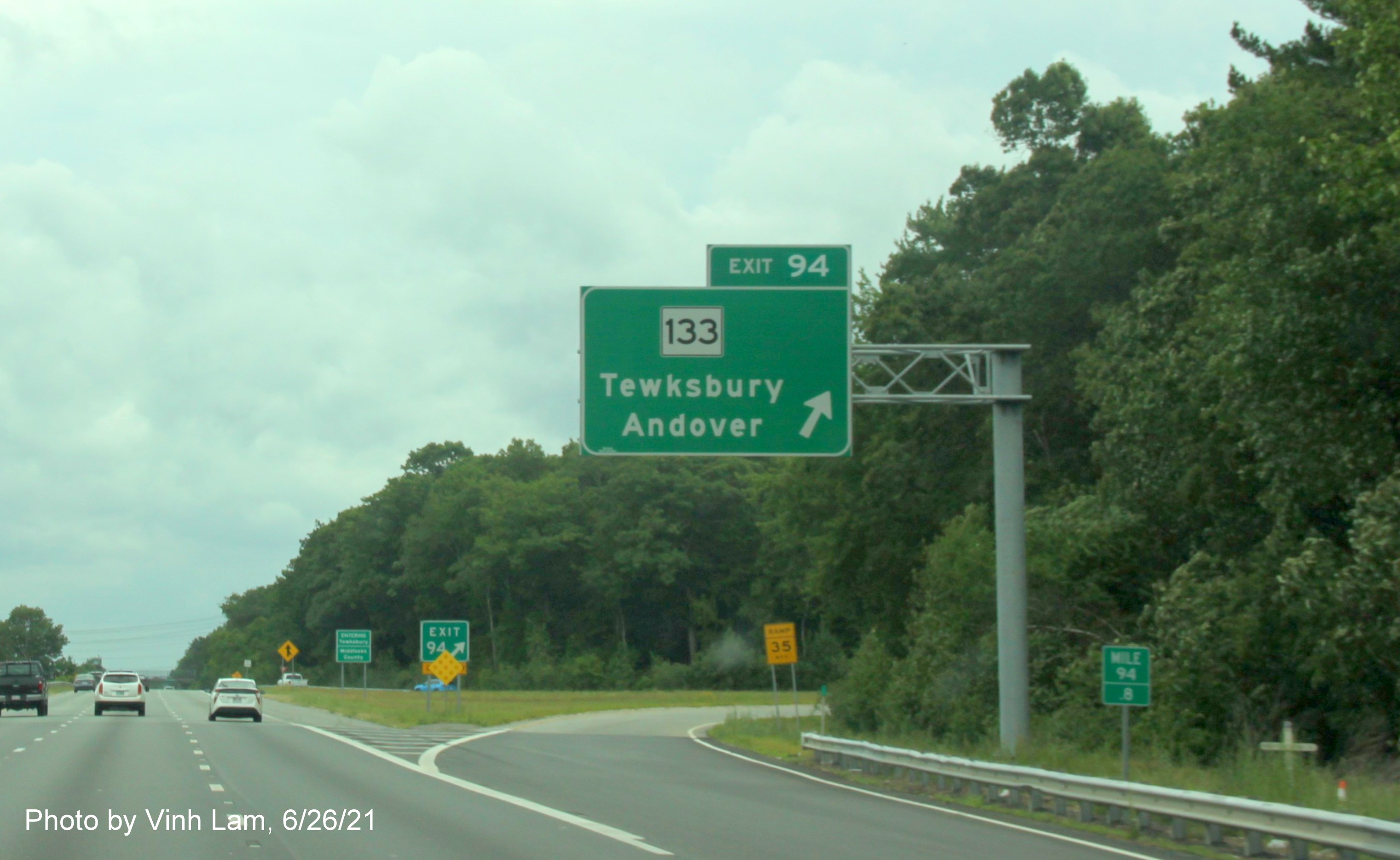 Image of overhead ramp sign for MA 133 exit with new milepost based exit number on I-495 South in Andover, by Vinh Lam, June 2021