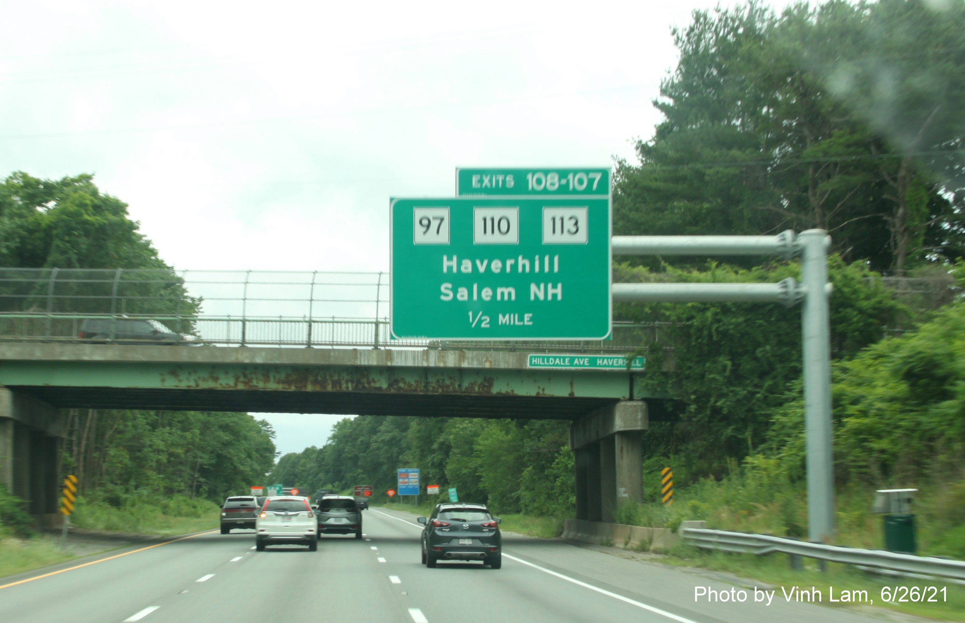 Image of 1/2 Mile advance overhead sign for MA 97 and MA 110/113 exits with new milepost based exit numbers on I-495 South in Haverhill, photo by Vinh Lam, June 2021