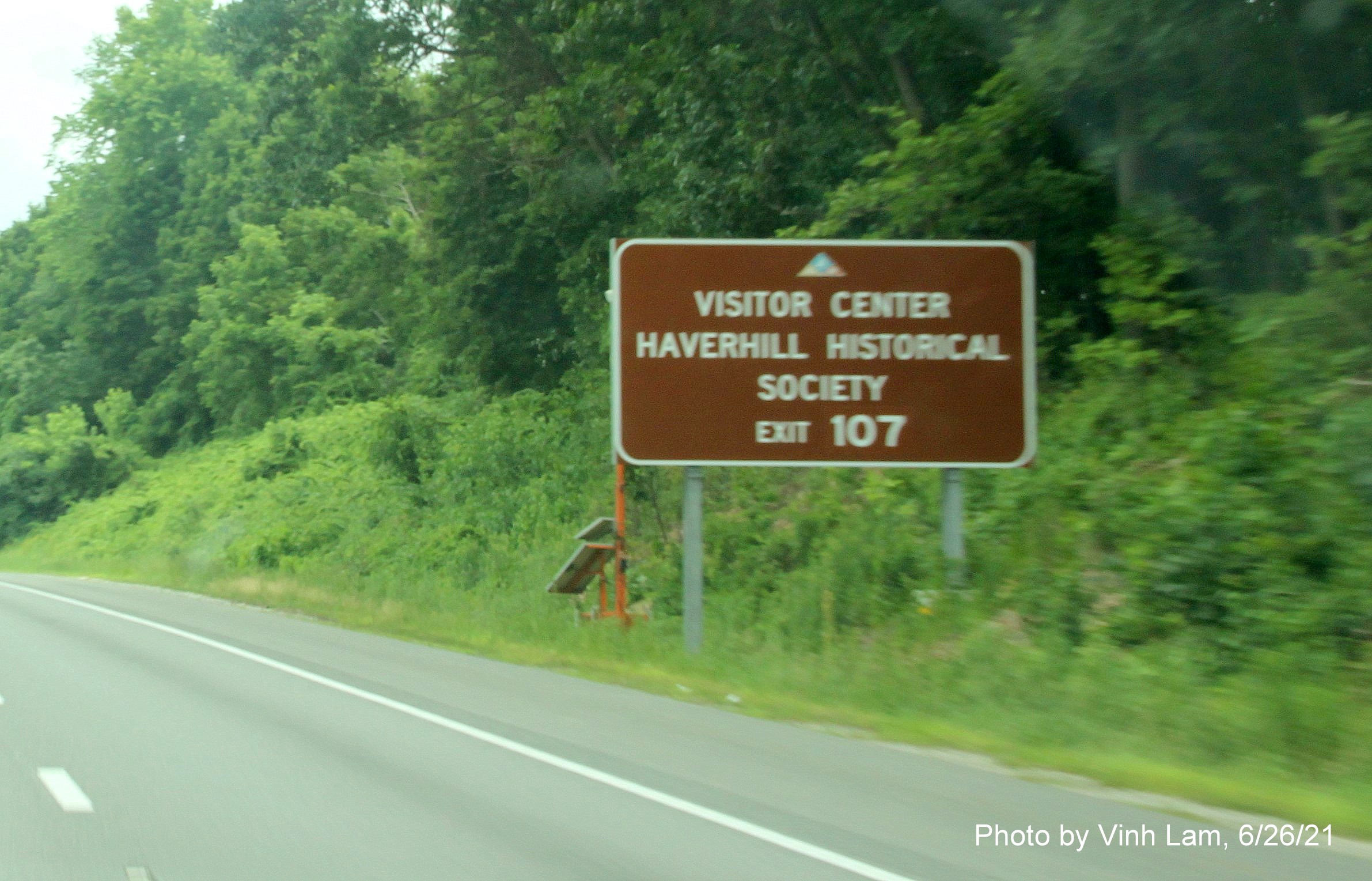 Image of auxiliary sign for MA 97 exit with new milepost based exit number on I-495 South in Haverhill, photo by Vinh Lam, June 2021