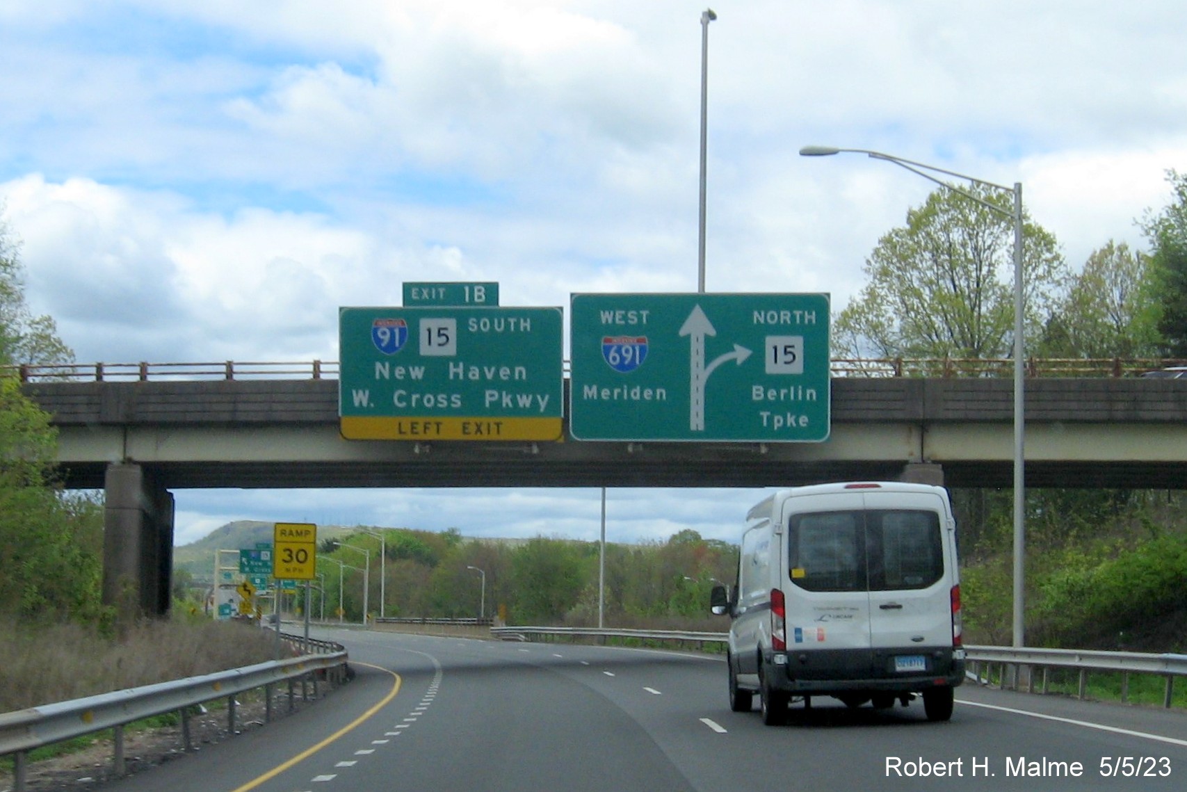 Image of overhead advance signs for I-91/CT 15 South exit with new milepost based exit number on I-691 West in Meriden CT, May 2023