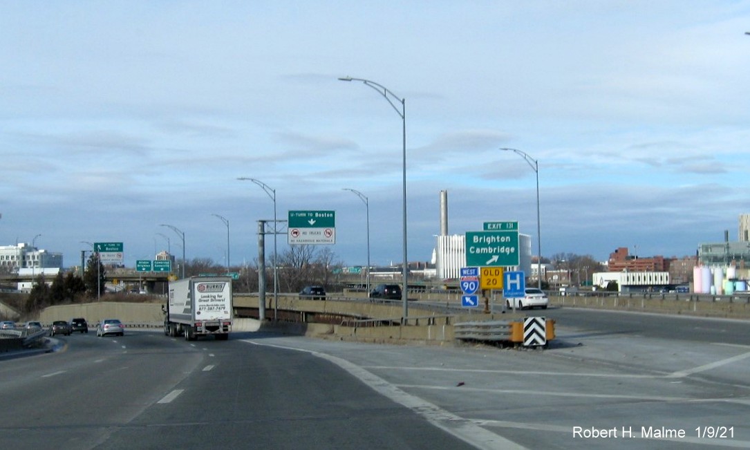 Image of gore sign for Allston-Brighton-Cambridge exit with new milepost based exit number and yellow old exit number sign below on I-90 West in Boston, January 2021