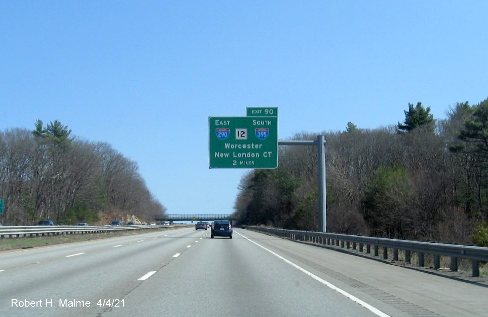 Image of 2 Miles advance overhead sign for I-290/I-395/MA 12 exit with new milepost based exit number 
                                             on I-90/Mass Pike East in Auburn, April 2021