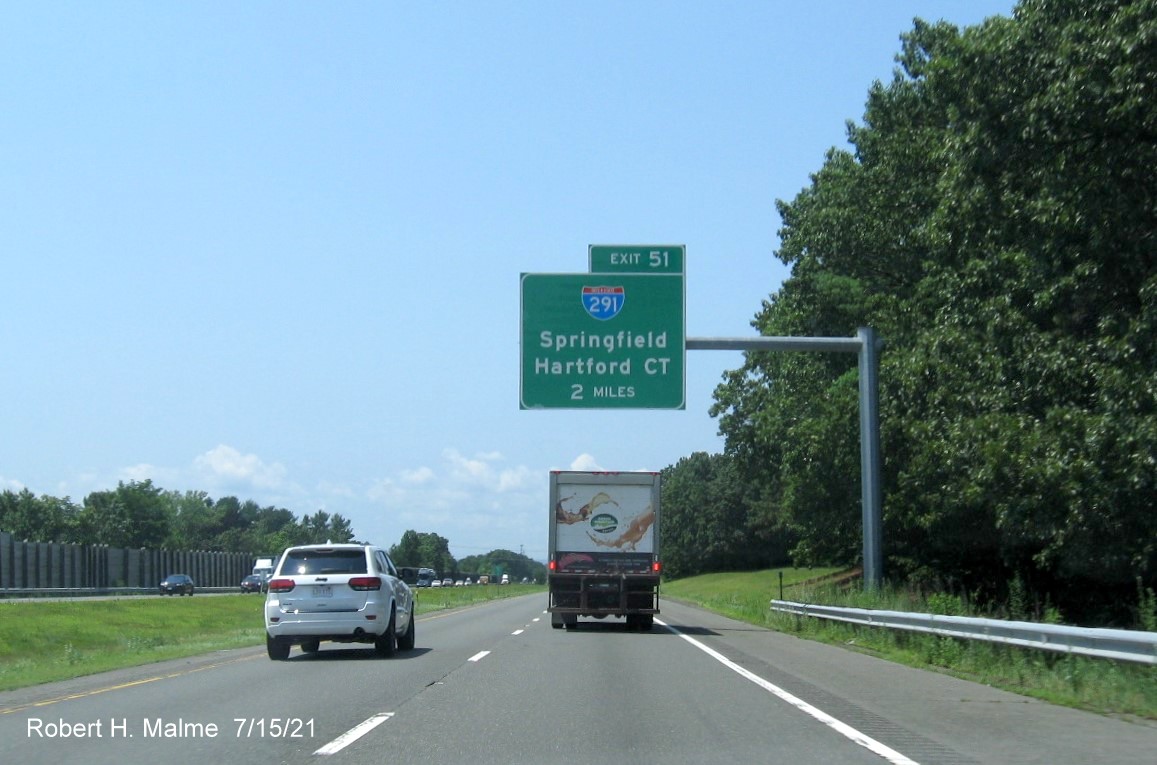 Image of 2 Miles advance overhead sign for I-291 exit with new milepost based exit number on I-90/Mass Pike West in Chicopee, July 2021