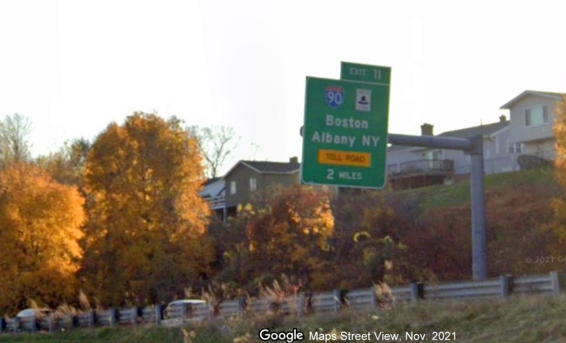 Image of 2 Miles advance overhead sign for I-90/Mass Pike exit with new milepost based exit number on I-91 South in Holyoke, Google Maps Street View image, November 2021