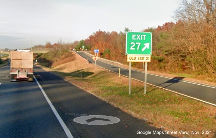 Image of gore sign for US 5/MA 10 exit with new milepost based exit number and yellow Old Exit 21 sign attached below on I-91 North in Hatfield, Google Maps Street View image, November 2021