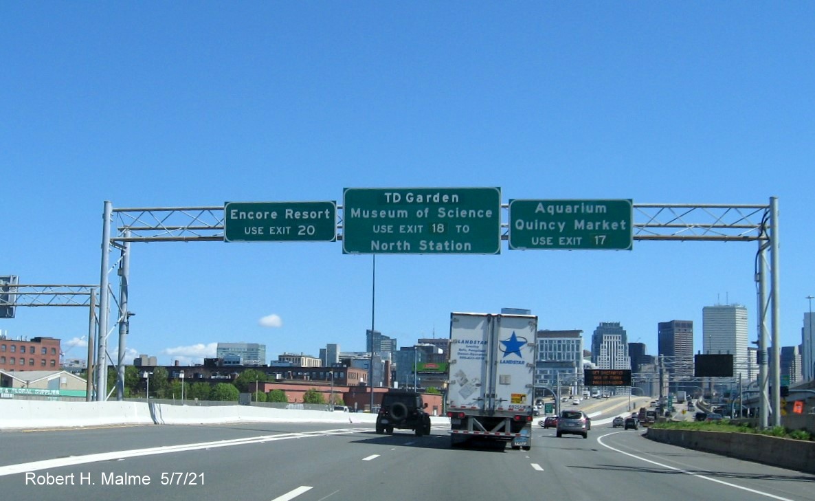 Image of tourist destination overhead auxiliary sign for Government Center and Storrow Drive exits with new milepost based exit numbers on I-93 North in South Boston, May 2021
