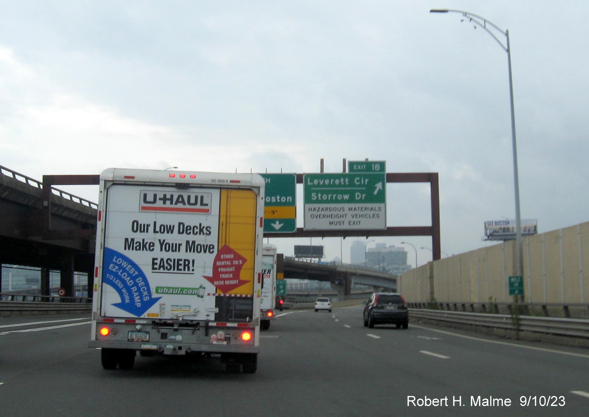 Image of new overhead signs at ramp to Storrow Drive exit with MA 3 and MA 28 shields removed, September 2023