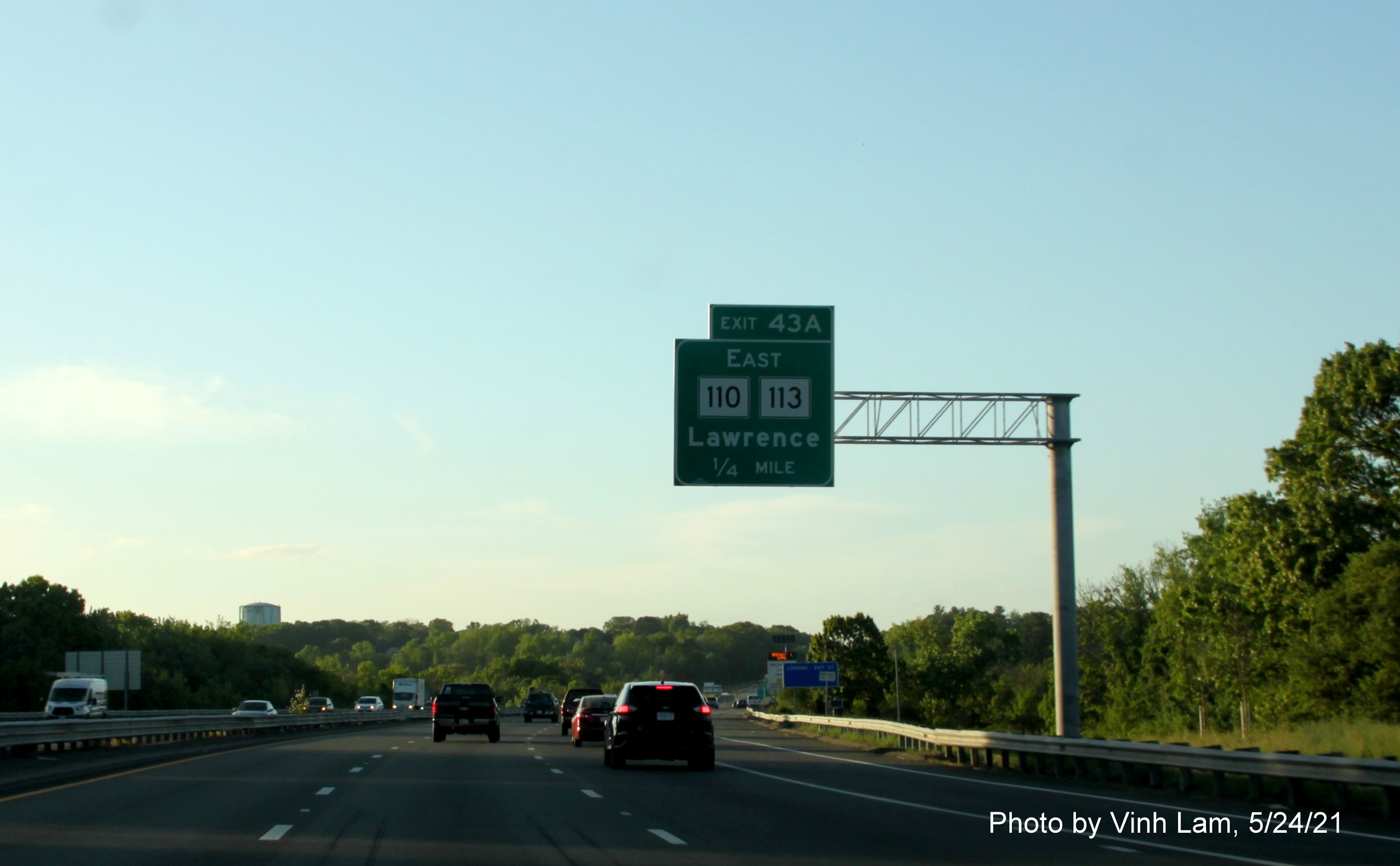 Image of 1/2 Mile advance overhead sign for MA 110/MA 113 East exit with new milepost based exit numbers on I-93 North in Andover, by Vinh Lam, May 2021