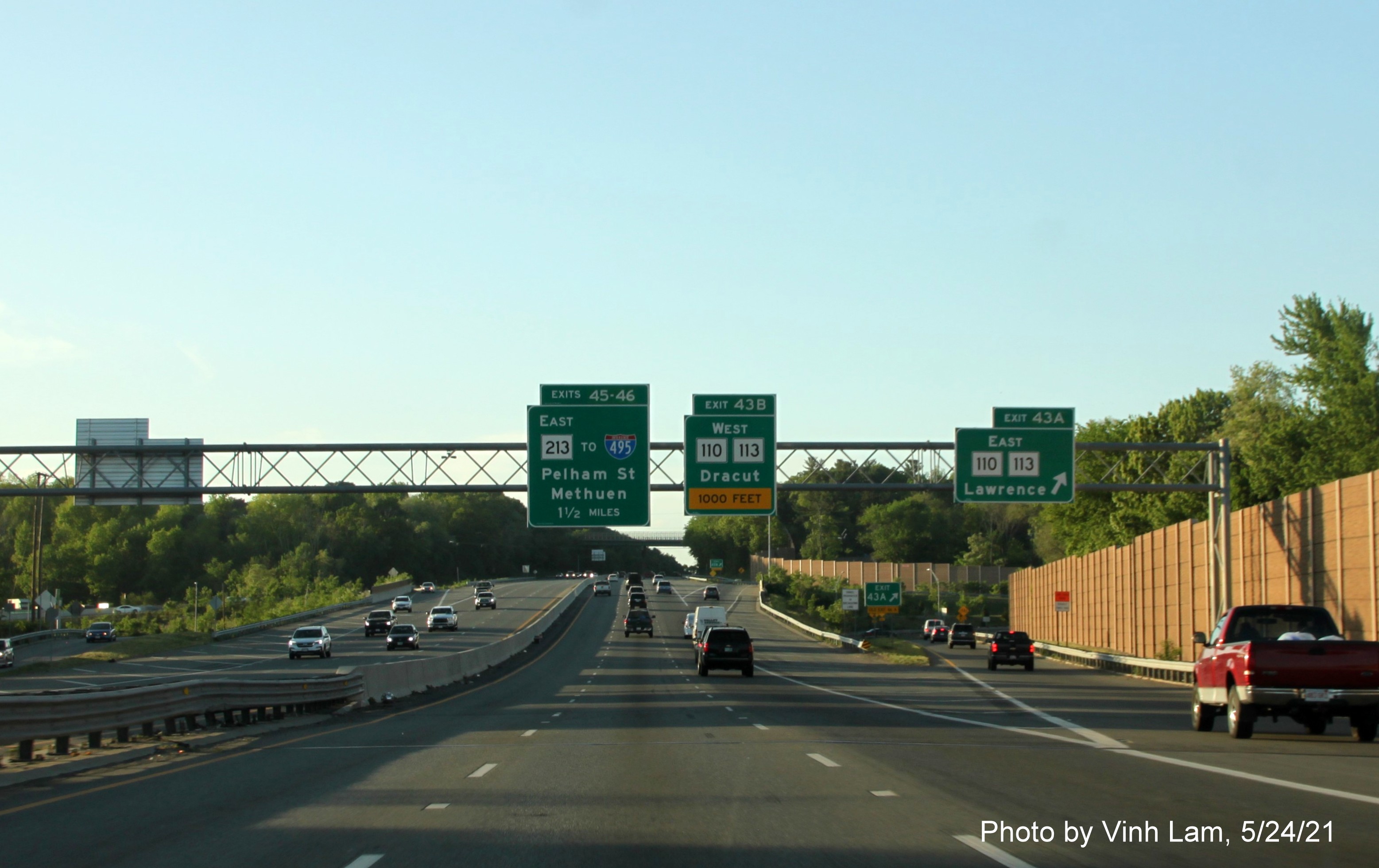 Image of overhead signage at ramp for MA 110/MA 113 East exit with new milepost based exit numbers on I-93 North in Andover, by Vinh Lam, May 2021