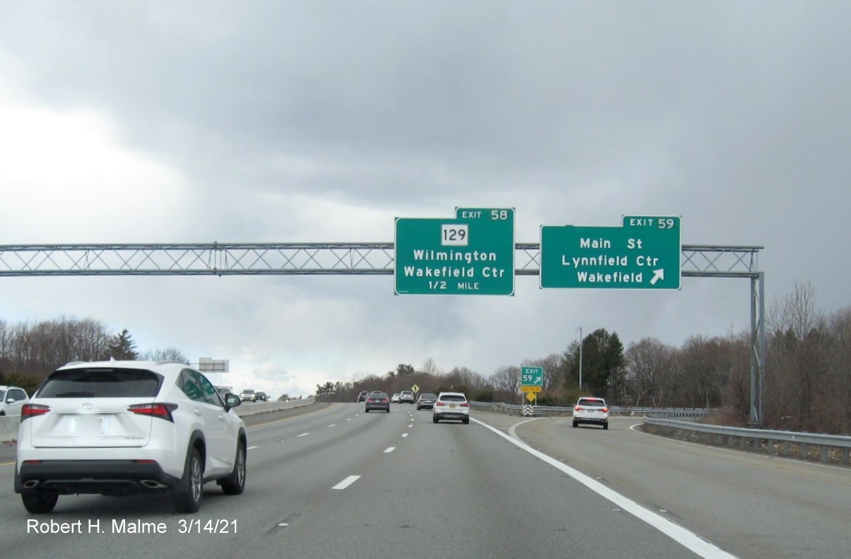 Image of overhead signage at ramp for Main Street exit with new milepost based exit numbers on I-95/MA 128 South in Wakefield, March 2021
