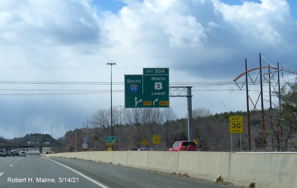 Image of overhead C/D ramp signs for US 3 North exit with new milepost based exit number on I-95/MA 128 South in Burlington, March 2021