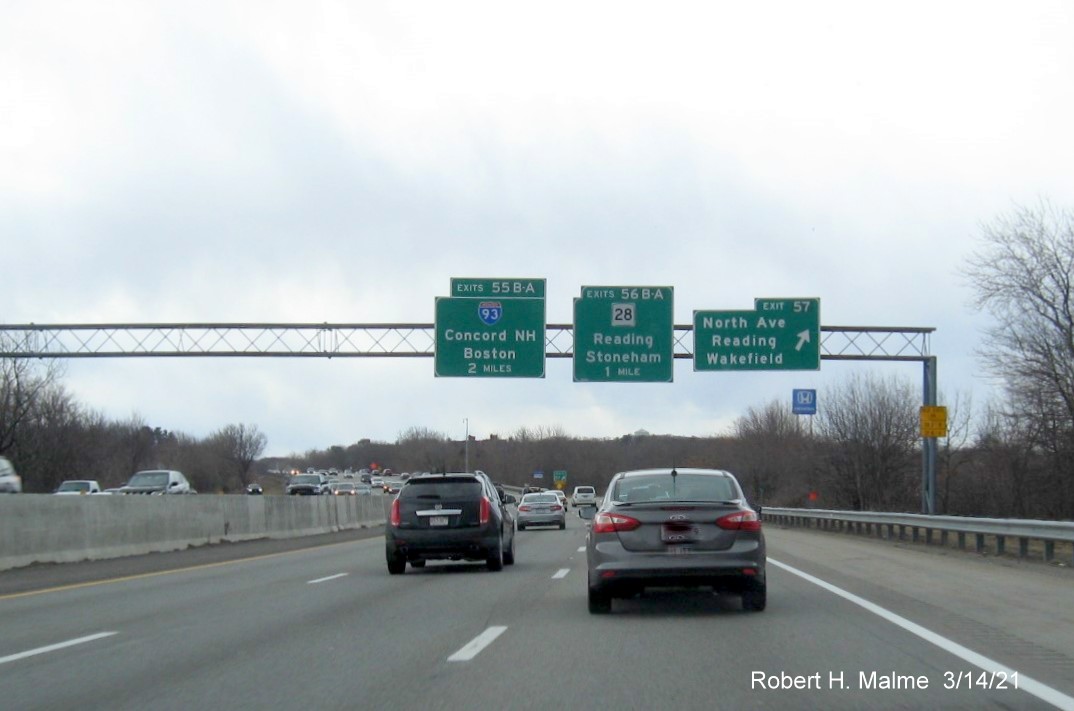 Image of overhead signs at ramp to Northern Avenue exit with new milepost based exit numbers on I-95/MA 128 South in Wakefield, March 2021