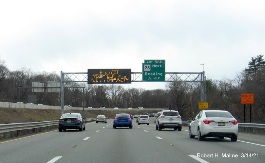 Image of 1/2 mile advance overhead sign for MA 28 North exit with new milepost based exit number on I-95/MA 128 South in Reading, March 2021
