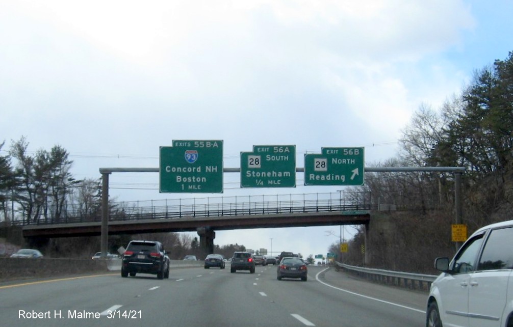 Image of overhead signage at ramp for MA 28 North exit with new milepost based exit numbers on I-95/MA 128 South in Reading, March 2021
