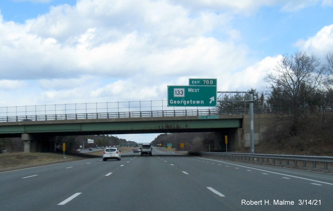 Image of overhead signage at ramp for MA 133 West exit with new milepost based exit number on I-95 North in Georgetown, March 2021 