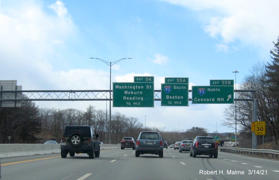 Image of overhead signage for I-93 exit with new milepost based exit numbers on I-95/MA 128 South in Woburn, March 2021