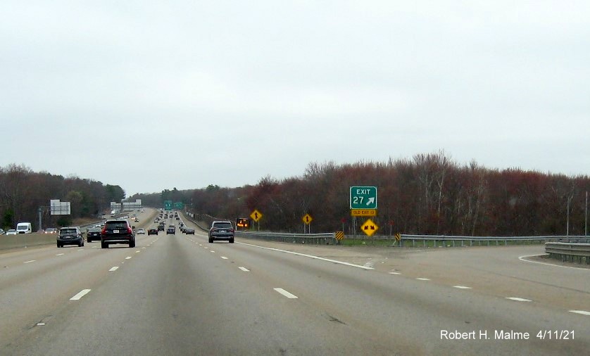 Image of gore sign for University Avenue exit with new milepost based exit number and yellow Old Exit 13 sign attached below on I-95/MA 128 North, US 1 South in Canton, April 2021