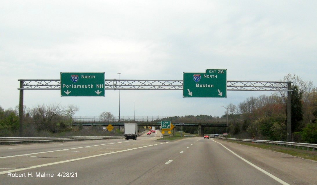 Image of overhead signage at ramp for I-93 North exit with new milepost based exit number on I-95 North in Canton, April 2021