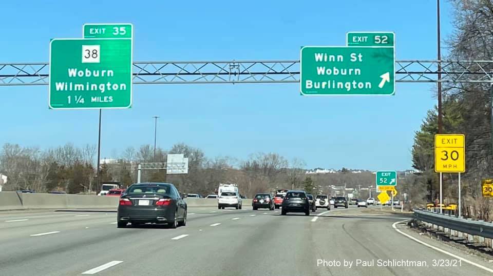 Image of overhead ramp sign for Winn Street exit with new milepost based exit number on I-95/MA 128 North in Woburn, by Paul Schlichtman, March 2021
