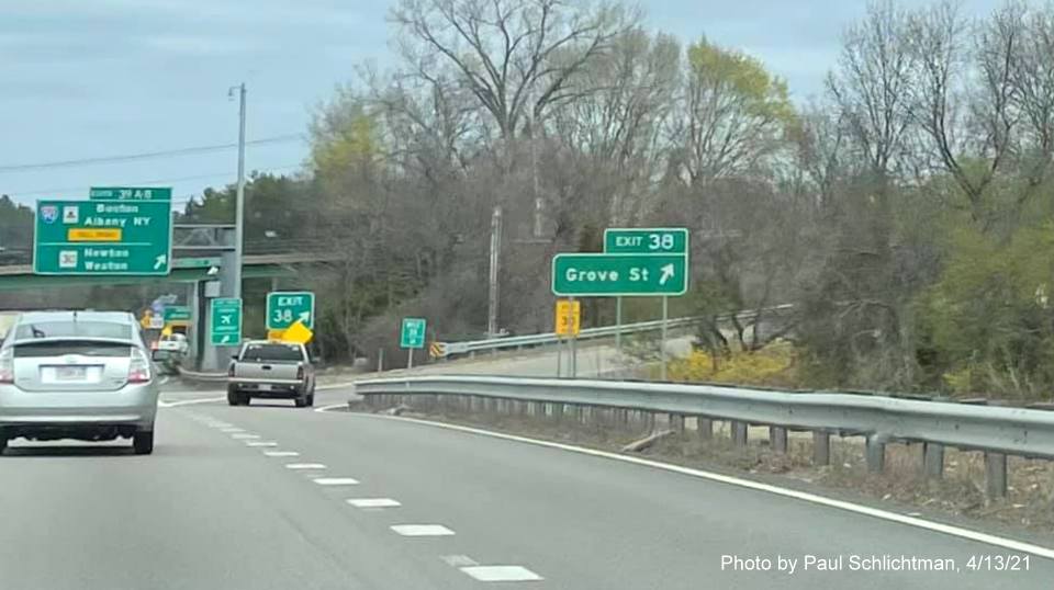 Image of overhead ramp sign for Grove Street exit with new milepost based exit number on I-95/128 North in Newton, by Paul Schlichtman, April 2021