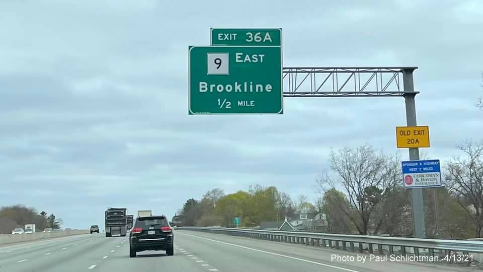 Image of 1/2 mile advance overhead sign for MA 9 East exit with new milepost based exit number and yellow Old Exit 20A sign on support on I-95/MA 128 North in Needham, by Paul Schlichtman, April 2021