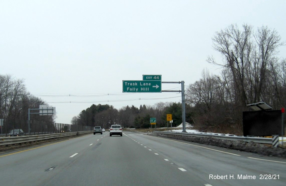 Image of overhead ramp sign for Trask Lane exit with new milepost based exit number on MA 128 North in Beverly, February 2021