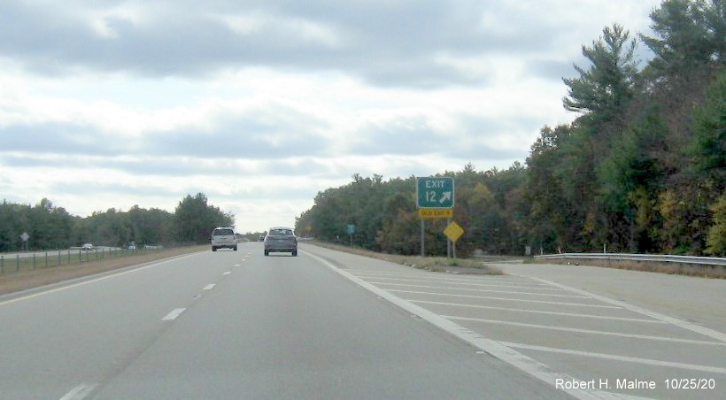 Image of gore sign for County Road exit with new exit number and yellow old exit number tab below on MA 140 South in Lakeville, October 2020