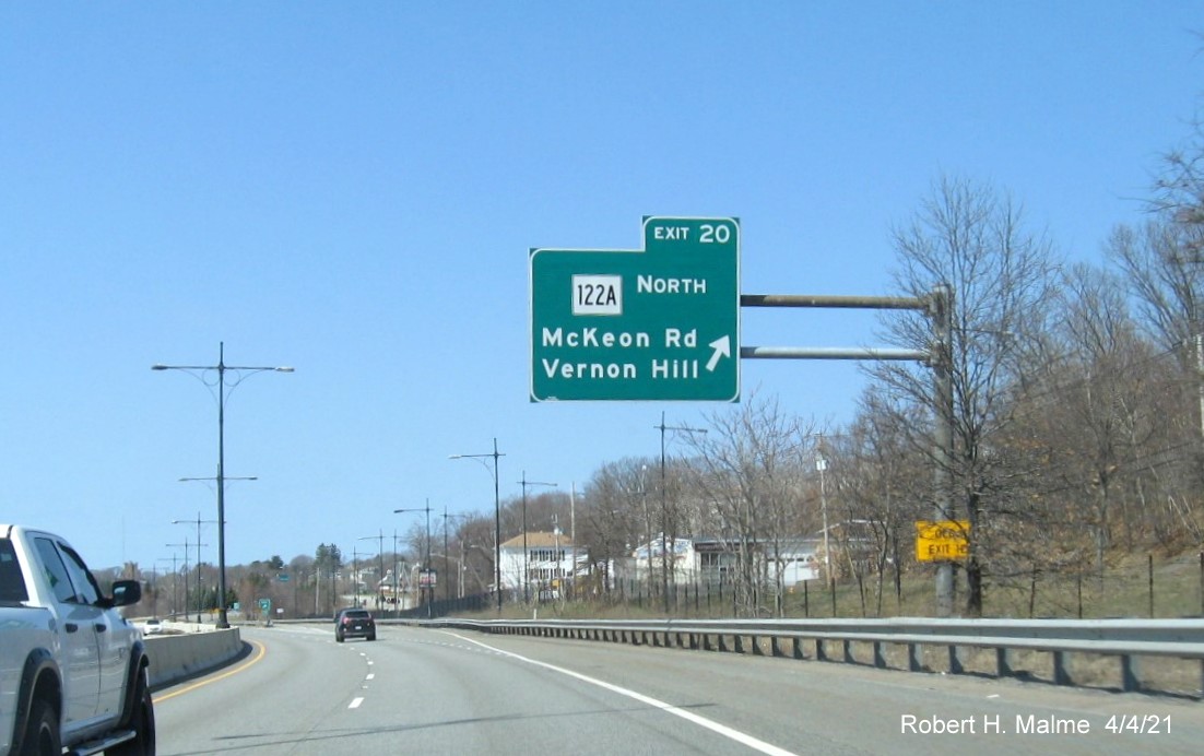 Image of overhead ramp sign for MA 122A North exit with new milepost based exit number on MA 146 North in Worcester, April 2021