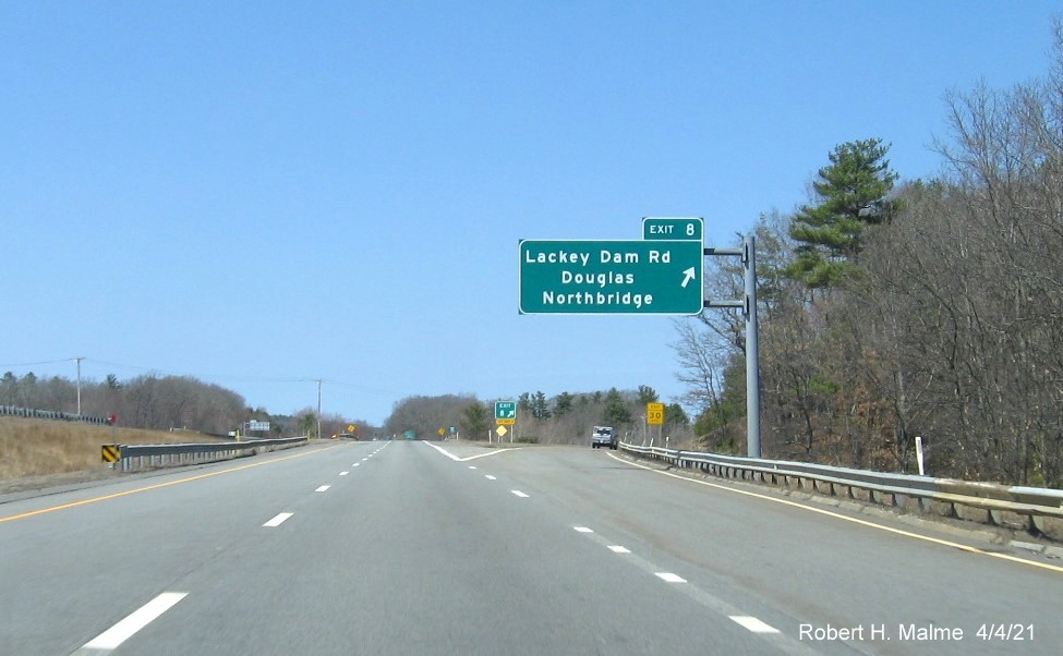 Image of overhead ramp sign for Lackey Dam Road exit with new milepost based exit number on MA 146 North in Douglas, April 2021