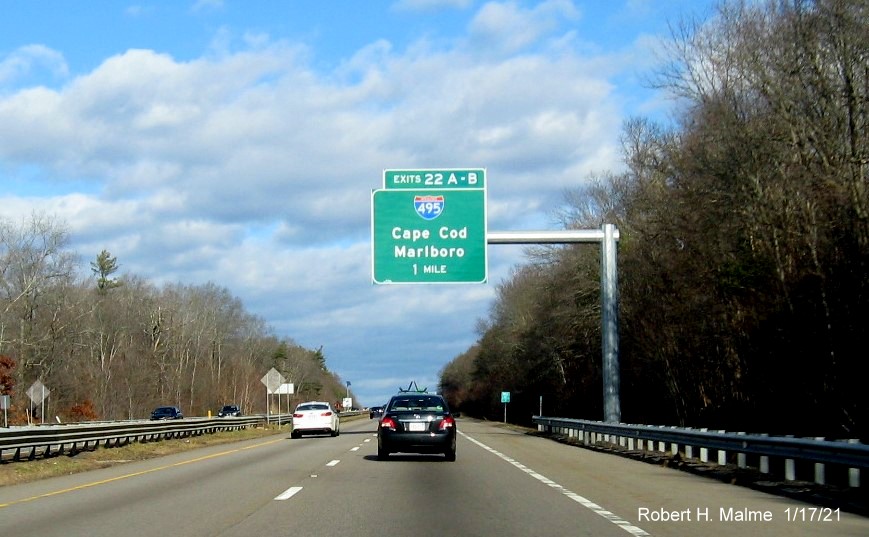 Image of 1-Mile advance overhead sign for I-495 exits with new milepost based exit numbers on MA 24 North in Raynham, January 2021