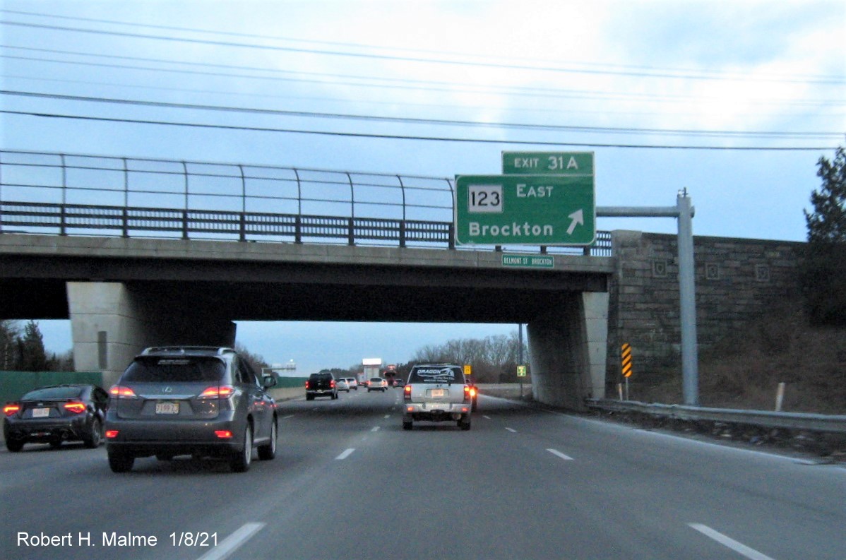 Image of overhead sign for MA 123 East exit with new milepost based exit number 
                                      on MA 24 South in Brockton, January 2021