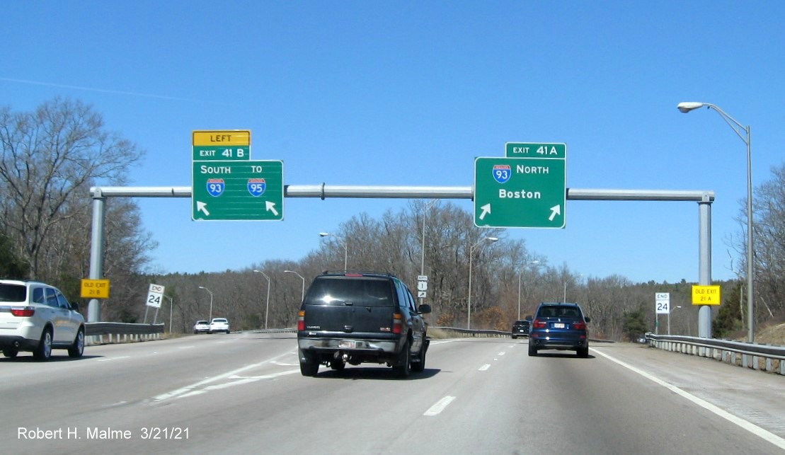 Image of overhead signs at I-93 exits with new milepost based exit number on MA 24 North in Randolph, now with old ganry removed, March 2021