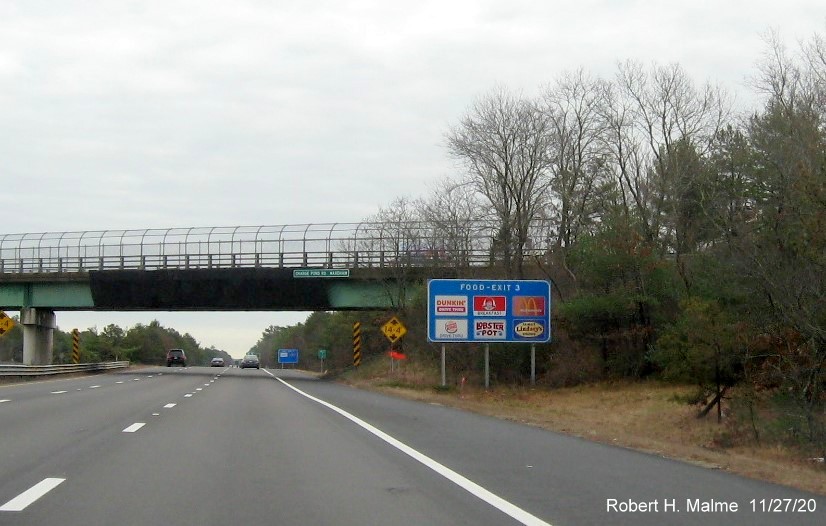 Image of ground mounted blue food services sign with new milepost based exit number on MA 25 East in Wareham, November 2020