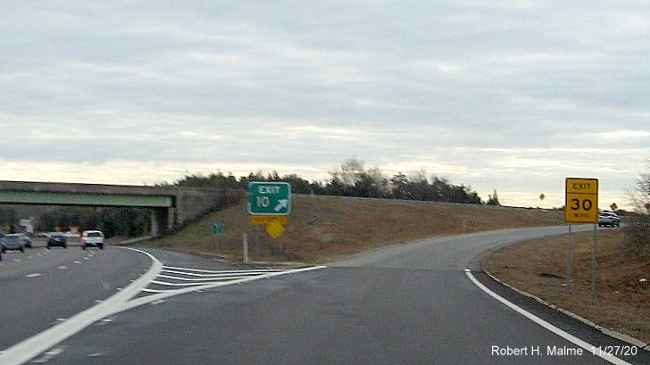 Image of gore sign at US 6 exit with new milepost based exit number and yellow old exit number tab below on MA 25 East in Bourne, November 2020