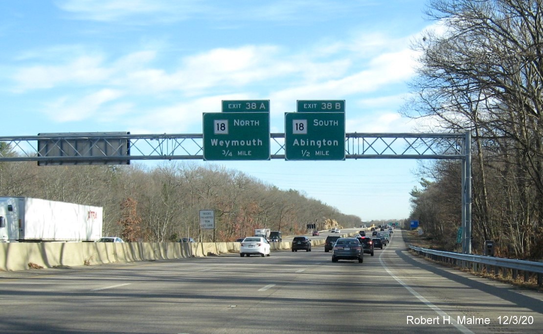 Image of 1/2 and 3/4-Mile advance overhead signs for MA 18 exits with new milepost based exit number on MA 3 South in Weymouth, December 2020