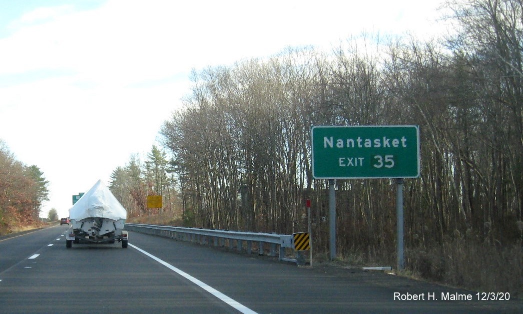 Image of auxiliary sign for MA 228 exit with new milepost based exit number on MA 3 South in Hingham, December 2020