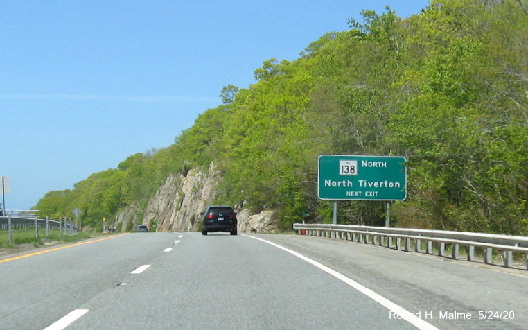 Image of newly placed ground mounted auxiliary sign for RI 77 exit on RI 24 South in Tiverton, taken May 2020