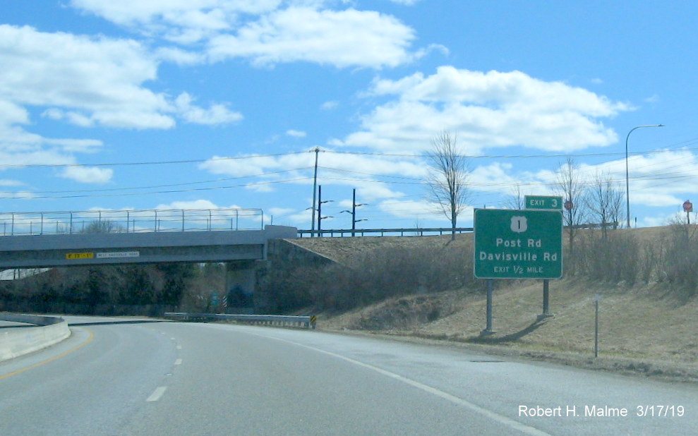 Image of new exit number tab on top of existing 1/2 mile advance sign for US 1 exit on RI 403 East in Davisville