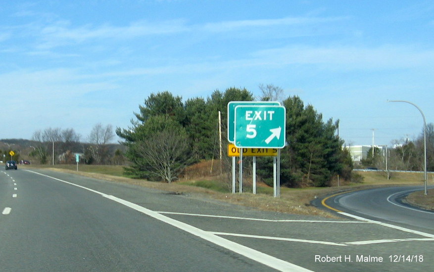Image of new Exit 3 gore sign with old exit 5 tab behind to be removed Exit 5 gore sign for RI 102 exit on RI 4 North in East Greenwich